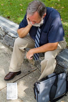 Unemployed looking for a job on newspaper